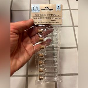 Mini glass containers with corks for crafting.  Pack of 7